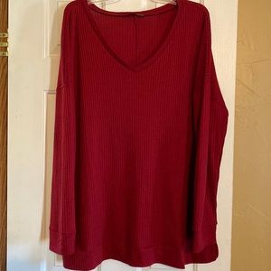 Like new, burgundy, long sleeve Sheila Rose top.  Sides have slits at waist.